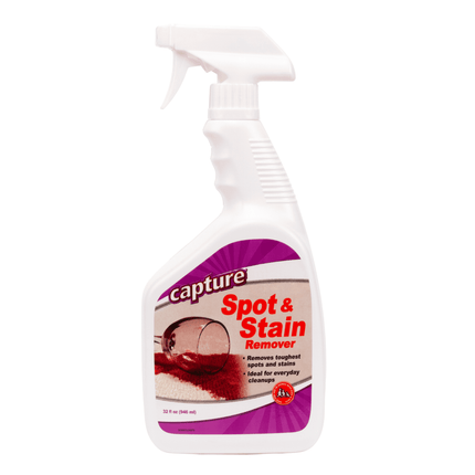 A white spray bottle labeled 'Capture Spot & Stain Remover 32 fluid Ounces' for carpet cleaning spot stain. 